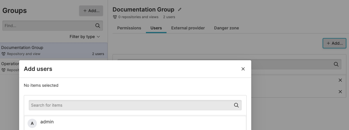 Screenshot of the LogScale 'Assign Users to Groups' dialog showing a user selection interface. This popup appears after clicking the '+ Add...' button in the Users tab of a group management page. The interface displays a dropdown or selection field where administrators can choose which existing user to add to the current group, along with a 'Save' button to confirm the assignment. This dialog enables administrators to populate groups with members who will automatically inherit all permissions and access rights assigned to the group, supporting efficient role-based access control management.