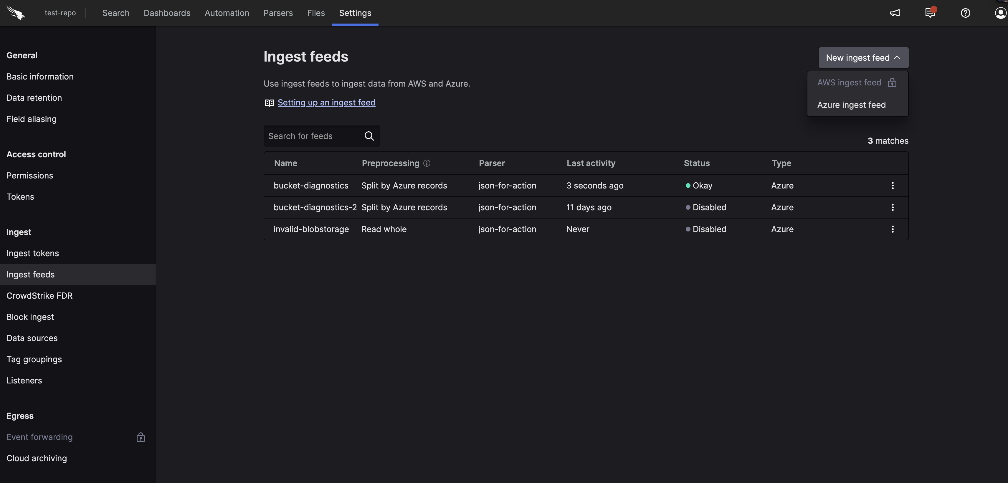 Screenshot of the LogScale Ingest feeds settings page showing the administrative interface where users begin the AWS ingest feed configuration process. The interface displays a tabular list of any existing configured ingest feeds with columns showing feed names, preprocessing methods used, assigned parsers, last activity timestamps, and current operational status. The page includes a prominent '+ New ingest feed' button at the top that users click to initiate the creation of a new AWS S3 ingest feed.